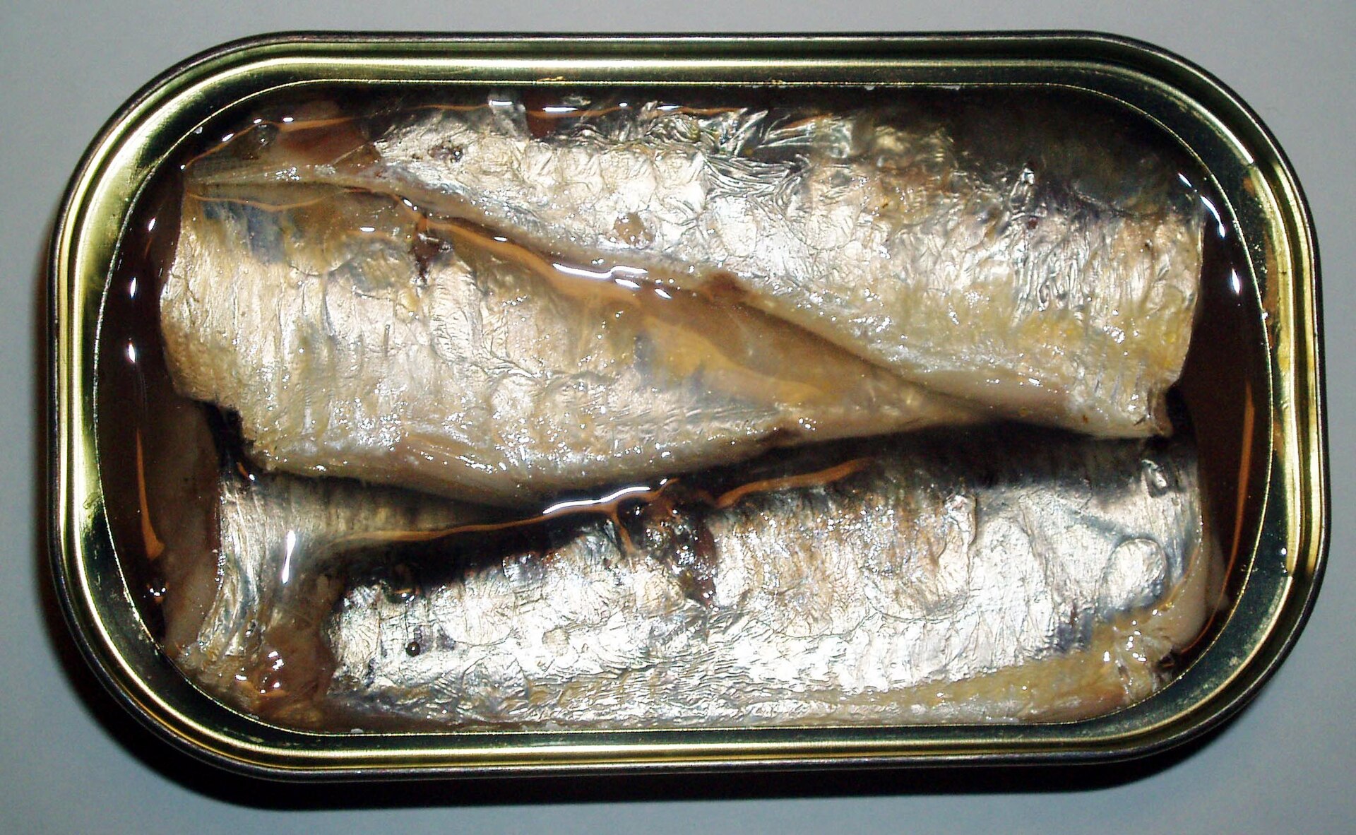 An open tin of sardines, seen from above